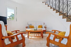 TV, fireplace - Villa 'Flor' with sea views, private pool and Wi-Fi (Les Tres Cales)