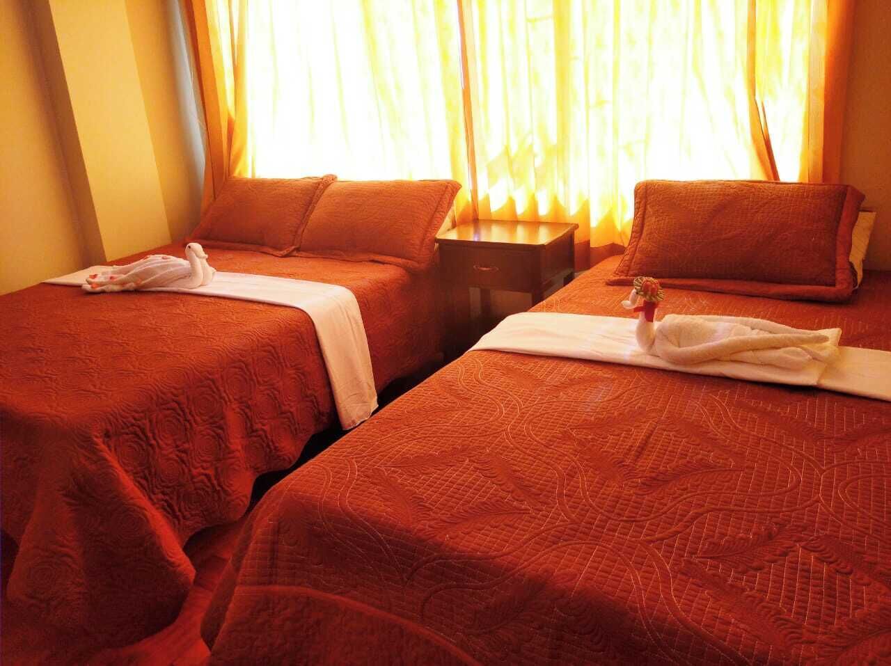 Habitació doble familiar, bany privat, vistes a la ciutat | Roba de llit d'alta qualitat i cobrellits 