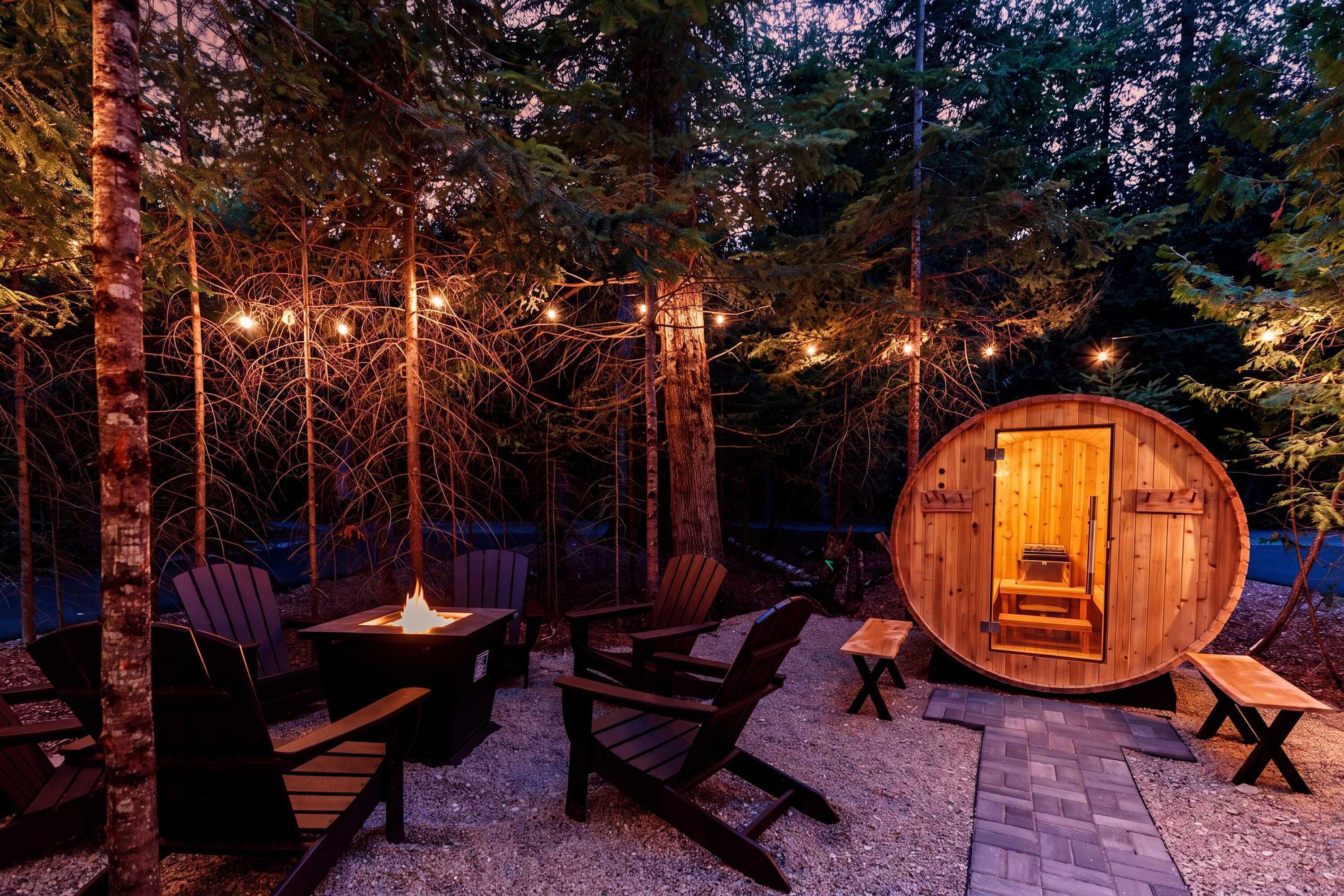 An outdoor seating area with Adirondack chairs, a fire pit, and a wooden barrel sauna.
