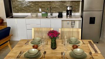 Fridge, microwave, stovetop, coffee/tea maker