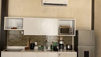 Fridge, microwave, stovetop, coffee/tea maker