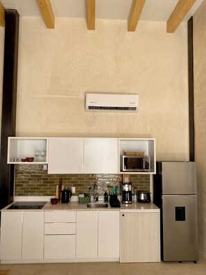 Fridge, microwave, stovetop, coffee/tea maker