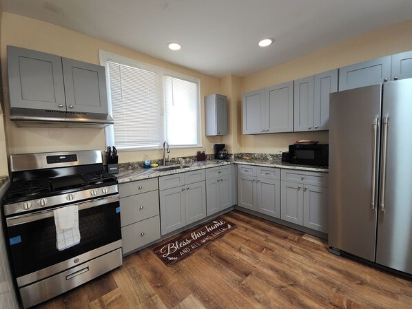Fridge, microwave, stovetop, coffee/tea maker