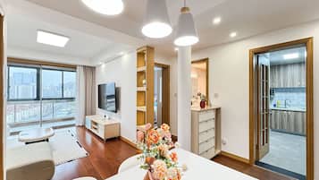 Condo, City View | Living area | 55-cm TV with digital channels