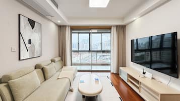 Condo, City View | Living area | 55-cm TV with digital channels