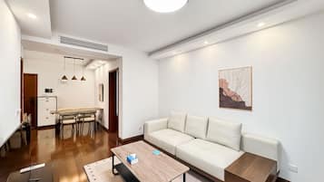 Condo, City View | Living area | 55-cm TV with digital channels