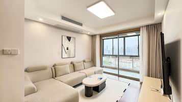 Condo, City View | Living area | 55-cm TV with digital channels