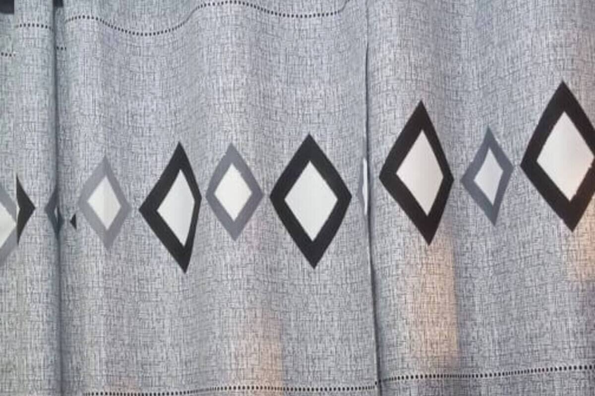 A curtain with a geometric pattern.