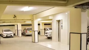 A multi-level parking garage with several cars parked. - Gulf Residency (Nairobi)