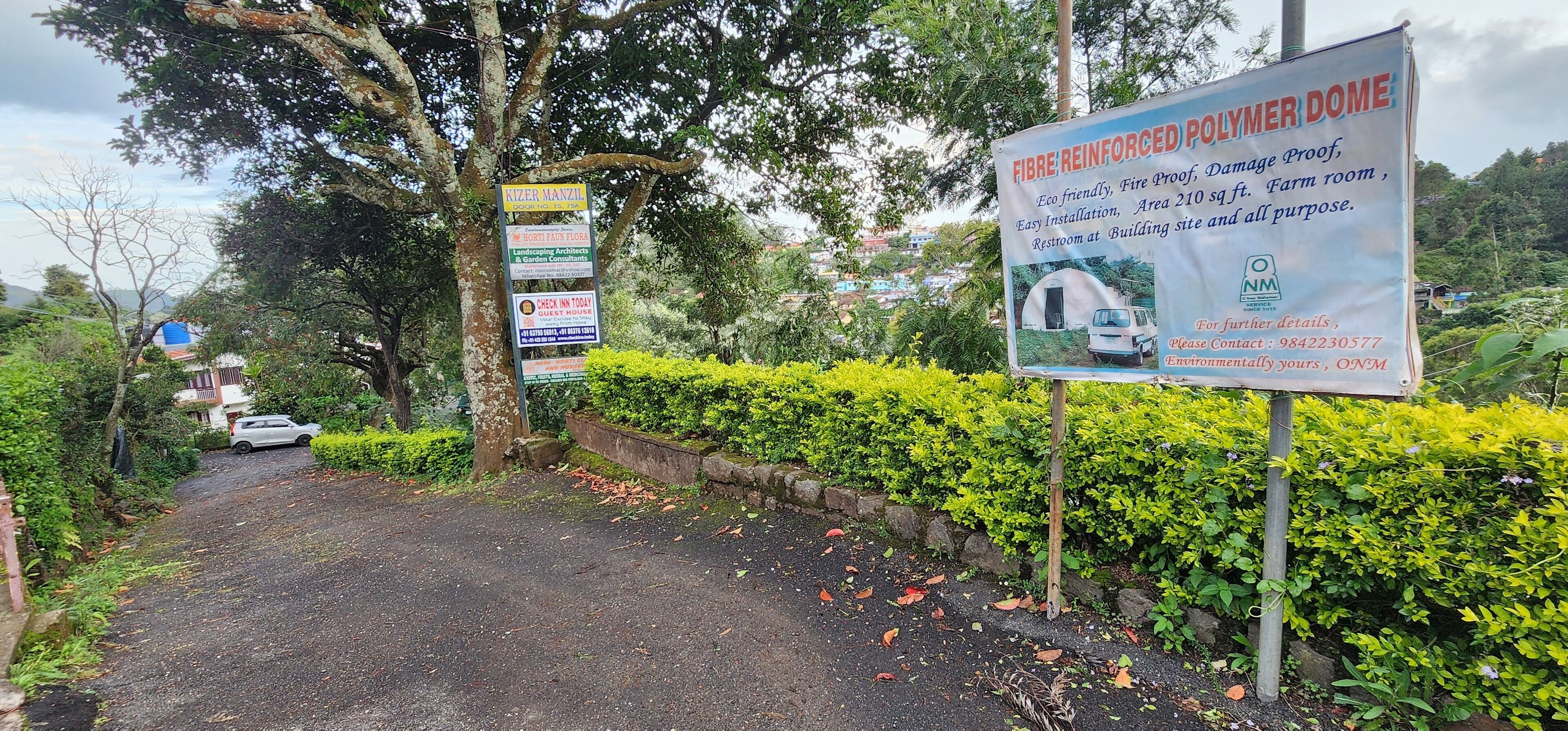 A signboard advertising a fibre-reinforced polymer dome with features like eco-friendliness, fireproofing, and a 210 sq ft farm room.