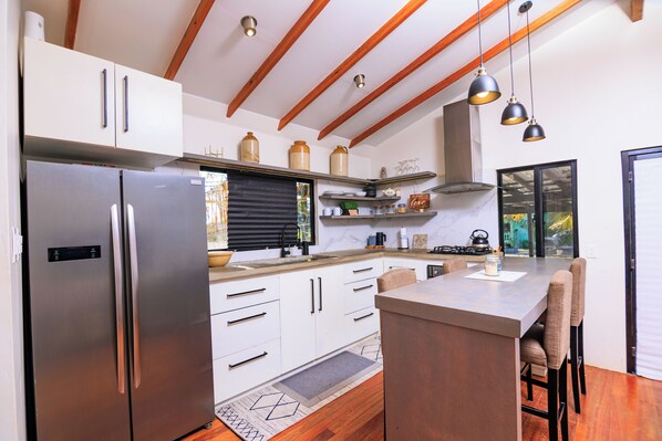 Fridge, stovetop, coffee/tea maker, cookware/dishes/utensils