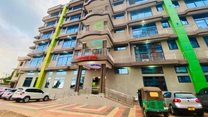 A multi-story hotel with balconies and a central entrance. - Gombe Park Hotel (Morogoro)