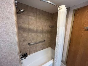 Shower, hair dryer, towels, shampoo
