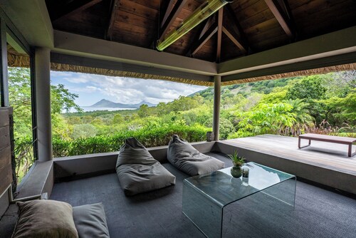 Luxury Villa Peaceful, highlights the natural surroundings and tranquility.