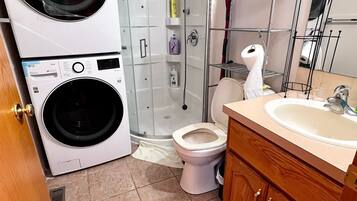 Shower, jetted bath, towels, soap