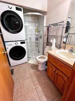 Shower, jetted tub, towels, soap