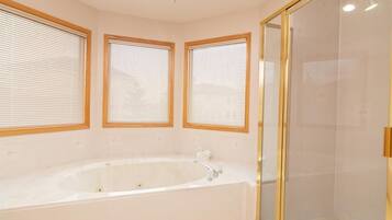 Shower, jetted tub, towels, soap