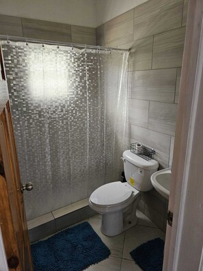 Shower, eco-friendly toiletries, towels, soap