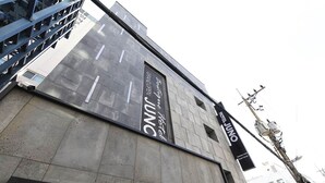 A modern building with a prominent sign for Hotel Juno. - HOTEL JUNO (Incheon)