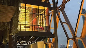 A modern building with a glass facade and a metal framework. - Scarletz Suites KLCC by Purple Orchid (Kuala Lumpur)