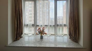 Condo, City View | Living area | 55-cm TV with digital channels