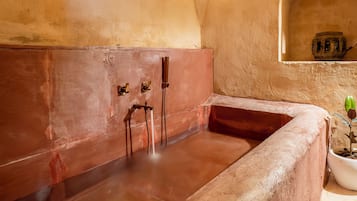 Royal Suite room with Bathtub | Bathroom | Designer toiletries, hair dryer, slippers, towels