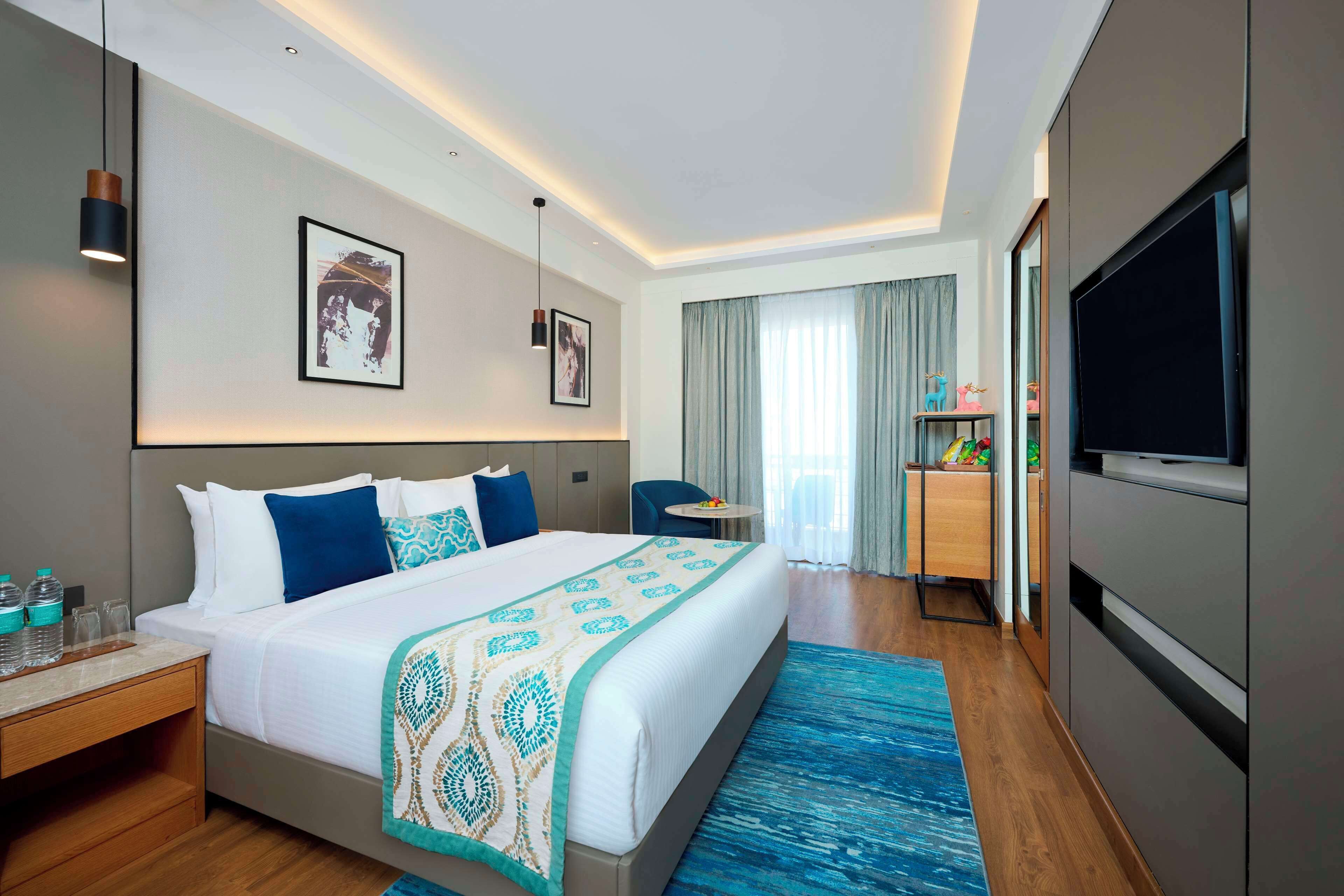 Camera Deluxe, 1 letto matrimoniale, balcone | Minibar, una cassaforte in camera, una scrivania, postazione laptop