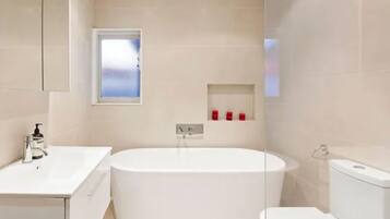 Shower, towels, soap, toilet paper