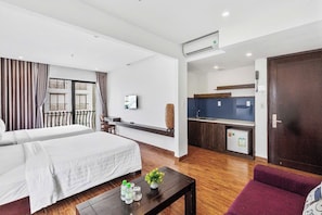 Family Studio Suite, Balcony, Sea View | Desk, laptop workspace, soundproofing, free WiFi