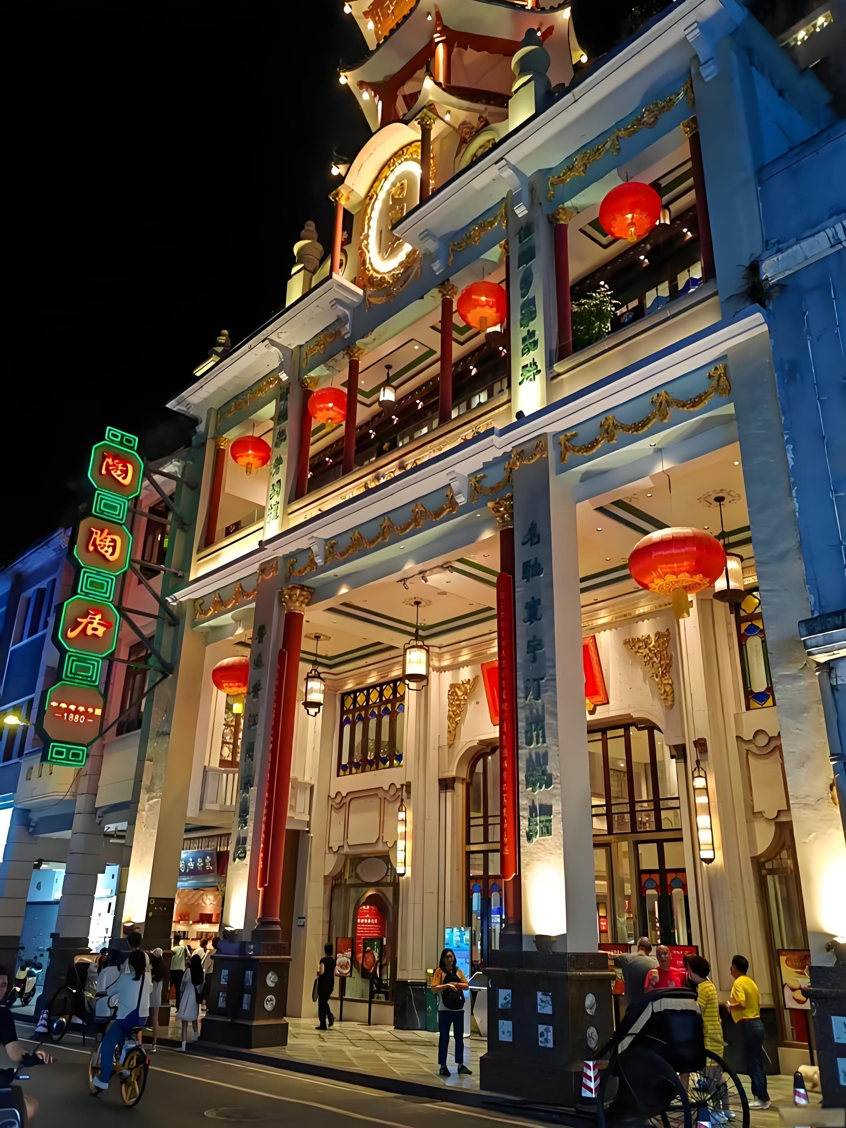 A traditional building with ornate architecture, including a prominent entrance and multiple levels.