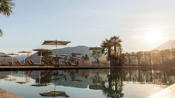 Indoor pool, seasonal outdoor pool, pool umbrellas, pool loungers