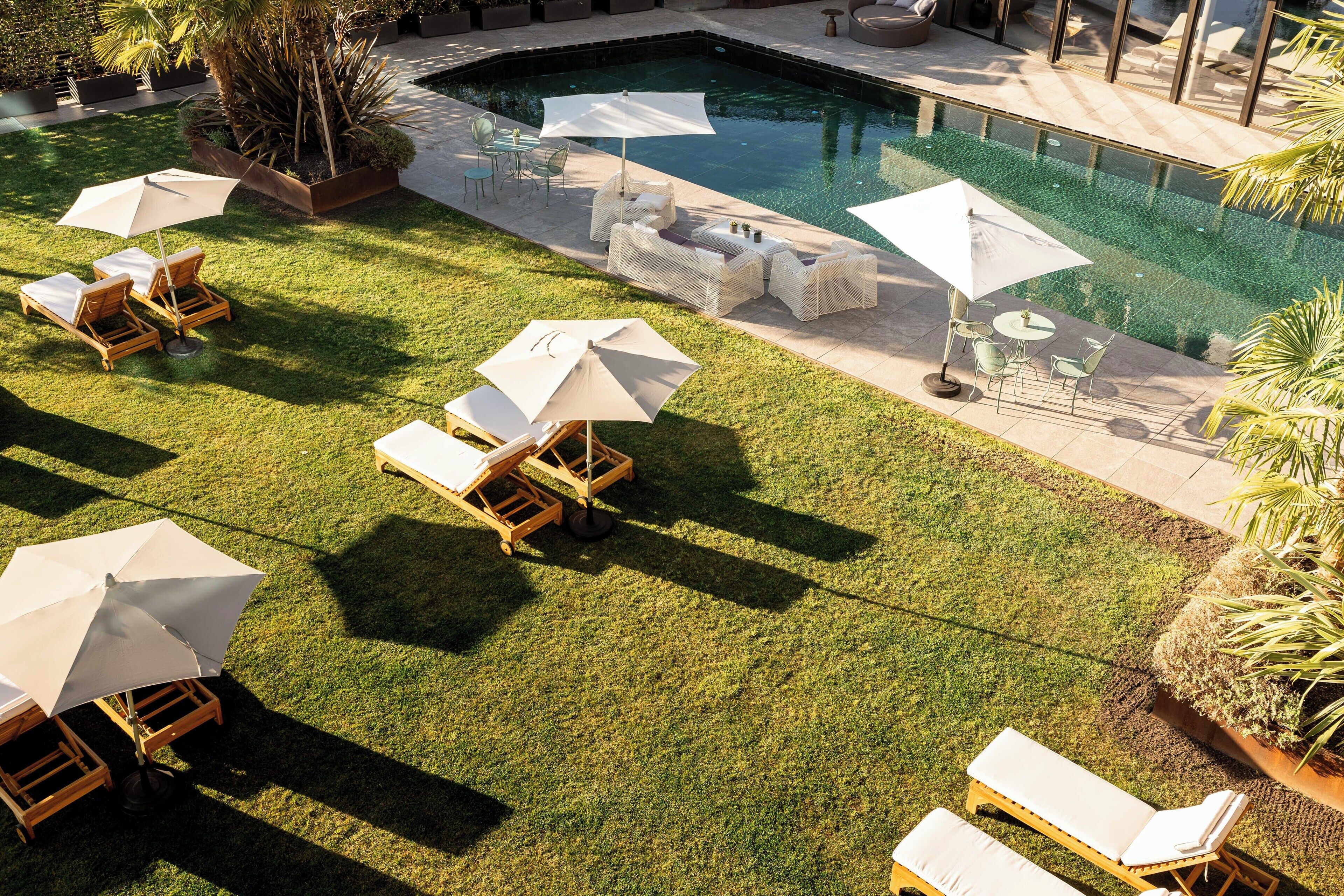 Indoor pool, seasonal outdoor pool, pool umbrellas, pool loungers