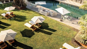 Indoor pool, seasonal outdoor pool, pool umbrellas, pool loungers