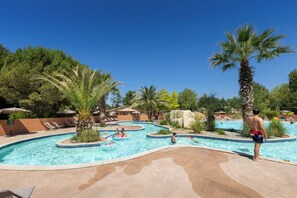 Seasonal outdoor pool, open 9:30 AM to 7:00 PM, pool umbrellas