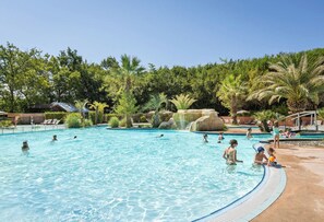 Seasonal outdoor pool, open 9:30 AM to 7:00 PM, pool umbrellas