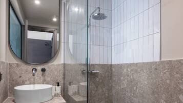 Shower, hair dryer, towels, soap