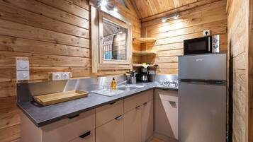 Family Chalet | Private kitchen | Stovetop, highchair, cookware/dishes/utensils, cleaning supplies