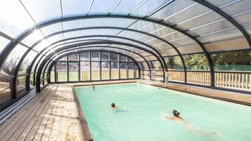 Seasonal outdoor pool, open 9:00 AM to 7:00 PM, pool umbrellas