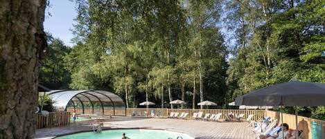 Seasonal outdoor pool, open 9:00 AM to 7:00 PM, pool umbrellas