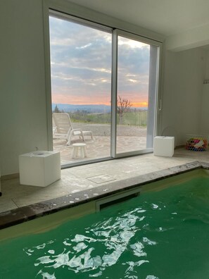 Indoor pool, a heated pool - Flat with balcony in renovated countryhouse with pools at Casale del Vacanziere (Toscana)