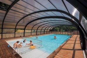Indoor pool, seasonal outdoor pool, pool umbrellas, pool loungers