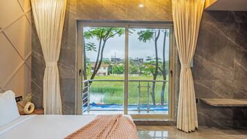 Family Room, Balcony, City View | Blackout curtains, iron/ironing board, free WiFi