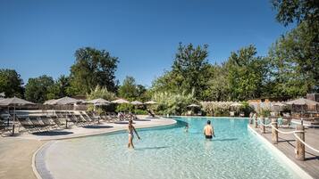 Seasonal outdoor pool, open 9:00 AM to 6:00 PM, pool umbrellas