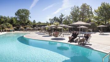 Seasonal outdoor pool, open 9:00 AM to 6:00 PM, pool umbrellas