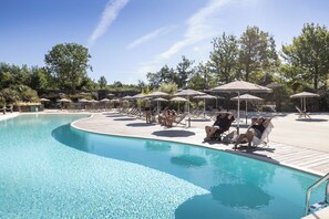 Seasonal outdoor pool, open 9:00 AM to 6:00 PM, pool umbrellas