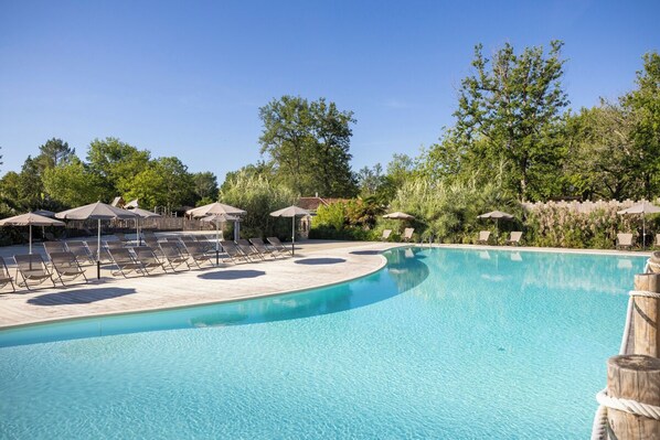 Seasonal outdoor pool, open 9:00 AM to 6:00 PM, pool umbrellas