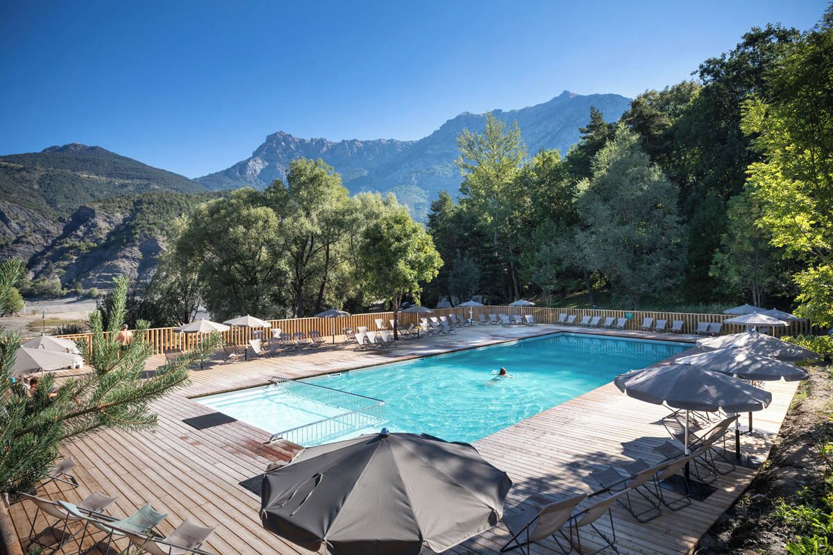 Seasonal outdoor pool, open 9:00 AM to 6:00 PM, pool umbrellas