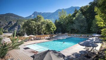 Seasonal outdoor pool, open 9:00 AM to 6:00 PM, pool umbrellas