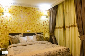 Luxury Room, City View | In-room safe, desk, laptop workspace, iron/ironing board - Noubou International Hotel Bonapriso (Douala)