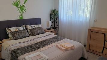 1 bedroom, desk, iron/ironing board, travel crib